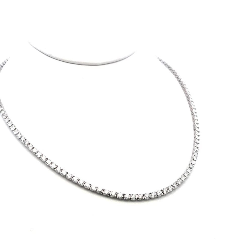 18K WHITE GOLD TENNIS NECKLACE WITH 9.72 CARAT ROUND G-VS DIAMONDS: 18K WHITE GOLD TENNIS NECKLACE WITH 9.72 CARAT ROUND G-VS DIAMONDS Detailed Description: Elevate your style game with this dazzling tennis necklace, featuring 9.72 carats of round brilliant diamonds. 