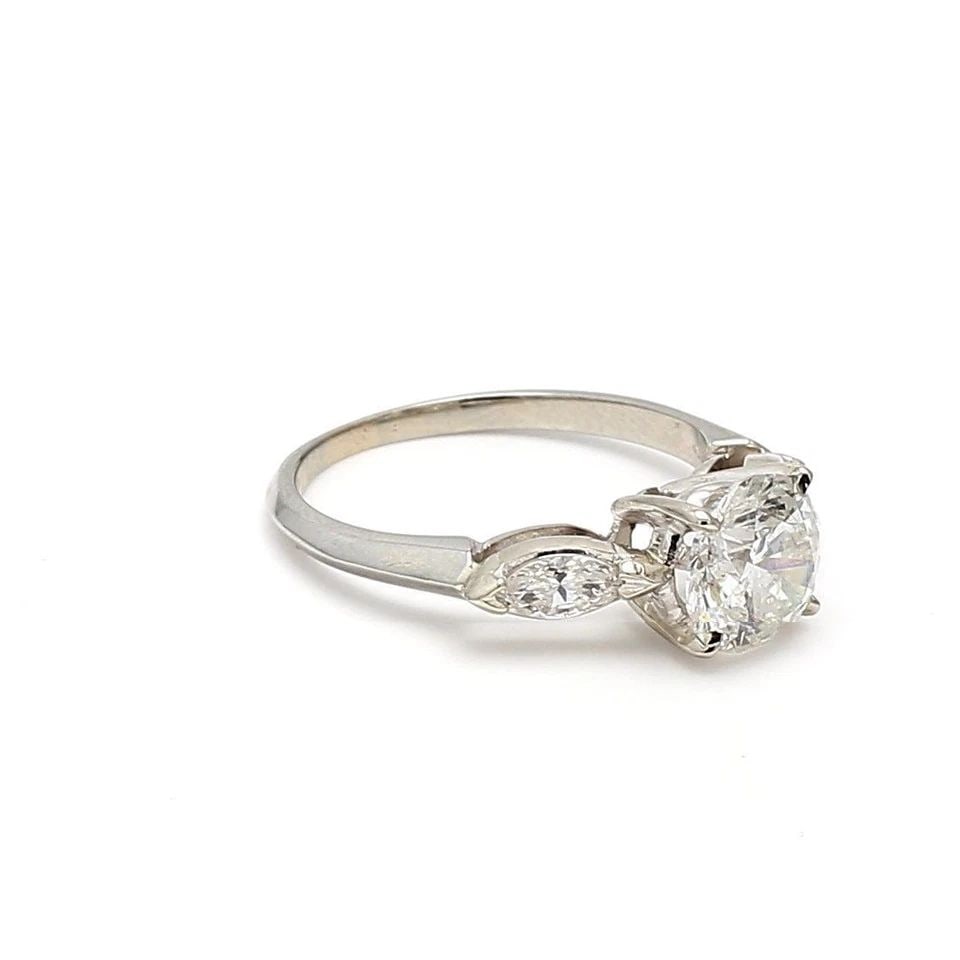2.30 CARAT ROUND BRILLIANT AND MARQUIS SHAPE DIAMOND PLATINUM ENGAGEMENT RING: 2.30 CARAT ROUND BRILLIANT AND MARQUIS SHAPE DIAMOND PLATINUM ENGAGEMENT RING Title: 2.30 Carat Round Brilliant H I1 and Marquis Shape H SI1 Diamond Platinum Engagement Ring Style: Engagement Metal: P