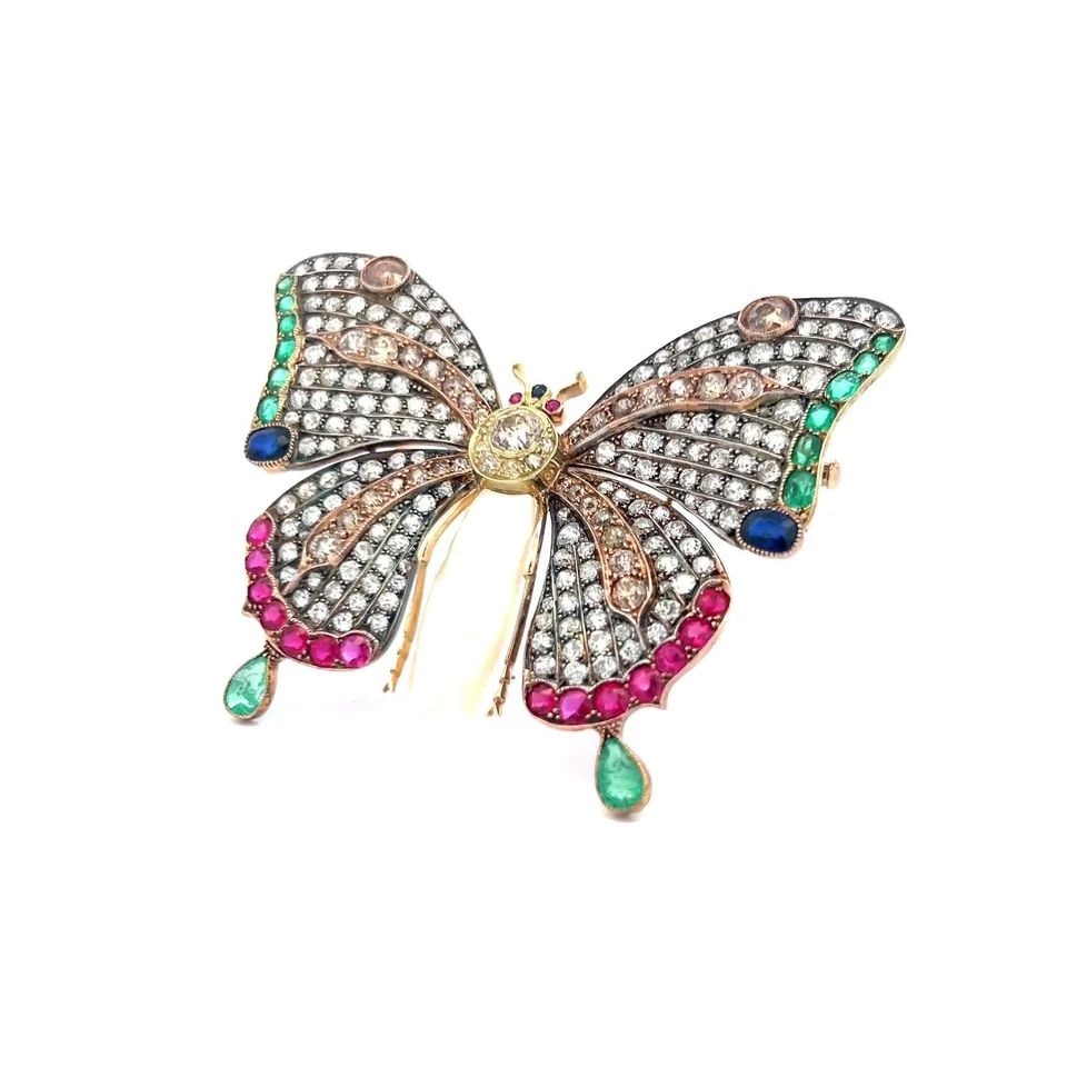 18K TRI COLOR GOLD BUTTERFLY PIN BROOCH WITH MULTI-STONE DESIGN 9+ CARAT DIAMOND: 18K TRI COLOR GOLD BUTTERFLY PIN BROOCH WITH MULTI-STONE DESIGN 9+ CARAT DIAMOND Video: Video Link Detailed Description: This vibrant butterfly pin radiates urban sophistication with its dynamic mix o
