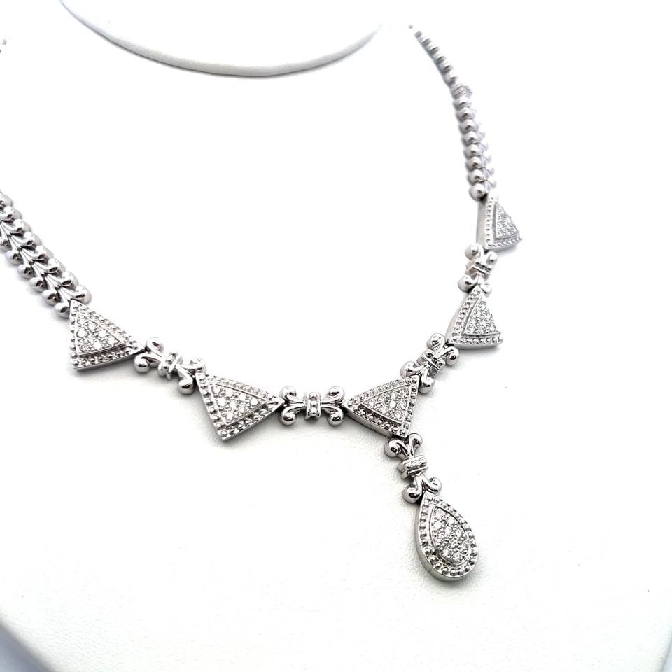 VINTAGE 14K WHITE GOLD PENDANT NECKLACE WITH 1.5 CARAT ROUND I-SI DIAMONDS: VINTAGE 14K WHITE GOLD PENDANT NECKLACE WITH 1.5 CARAT ROUND I-SI DIAMONDS Detailed Description: Shine bright with this vintage 14K white gold pendant, featuring a dazzling 1.5-carat diamond in a roun