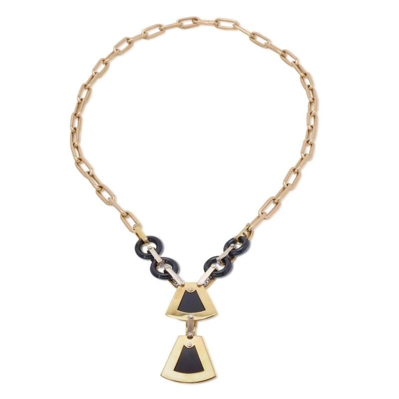 0.85 CARAT ROUND BRILLIANT DIAMOND AND ONYX 18K YG PENDANT NECKLACE: 0.85 CARAT ROUND BRILLIANT DIAMOND AND ONYX 18K YG PENDANT NECKLACE Title: 0.85 Carat Round Brilliant Diamond and Onyx 18 Karat Yellow Gold Pendant Necklace Style: Pendant Metal: 18 Karat Yellow Gold 