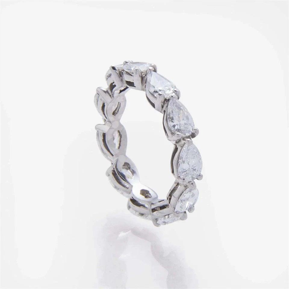 3.30 CARAT PEAR SHAPE G VS1 DIAMOND PLATINUM ETERNITY BAND RING: 3.30 CARAT PEAR SHAPE G VS1 DIAMOND PLATINUM ETERNITY BAND RING Title: 3.30 Carat Pear Shape G VS1 Diamond Platinum Eternity Band Ring Style: Eternity Band Metal: Platinum Gemstone 1: 3.3 Carat Diamon