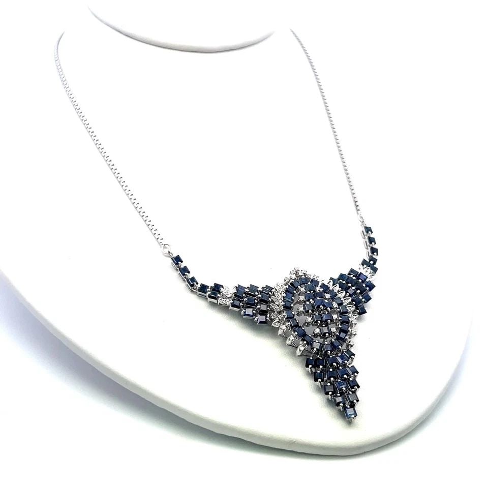 9.60 CARAT ASSCHER CUT SAPPHIRE & DIAMOND PENDANT NECKLACE IN 14K WHITE GOLD: 9.60 CARAT ASSCHER CUT SAPPHIRE & DIAMOND PENDANT NECKLACE IN 14K WHITE GOLD Title: This striking vintage sapphire and diamond pendant necklace is crafted in elegant 14 karat white gold and showcases 