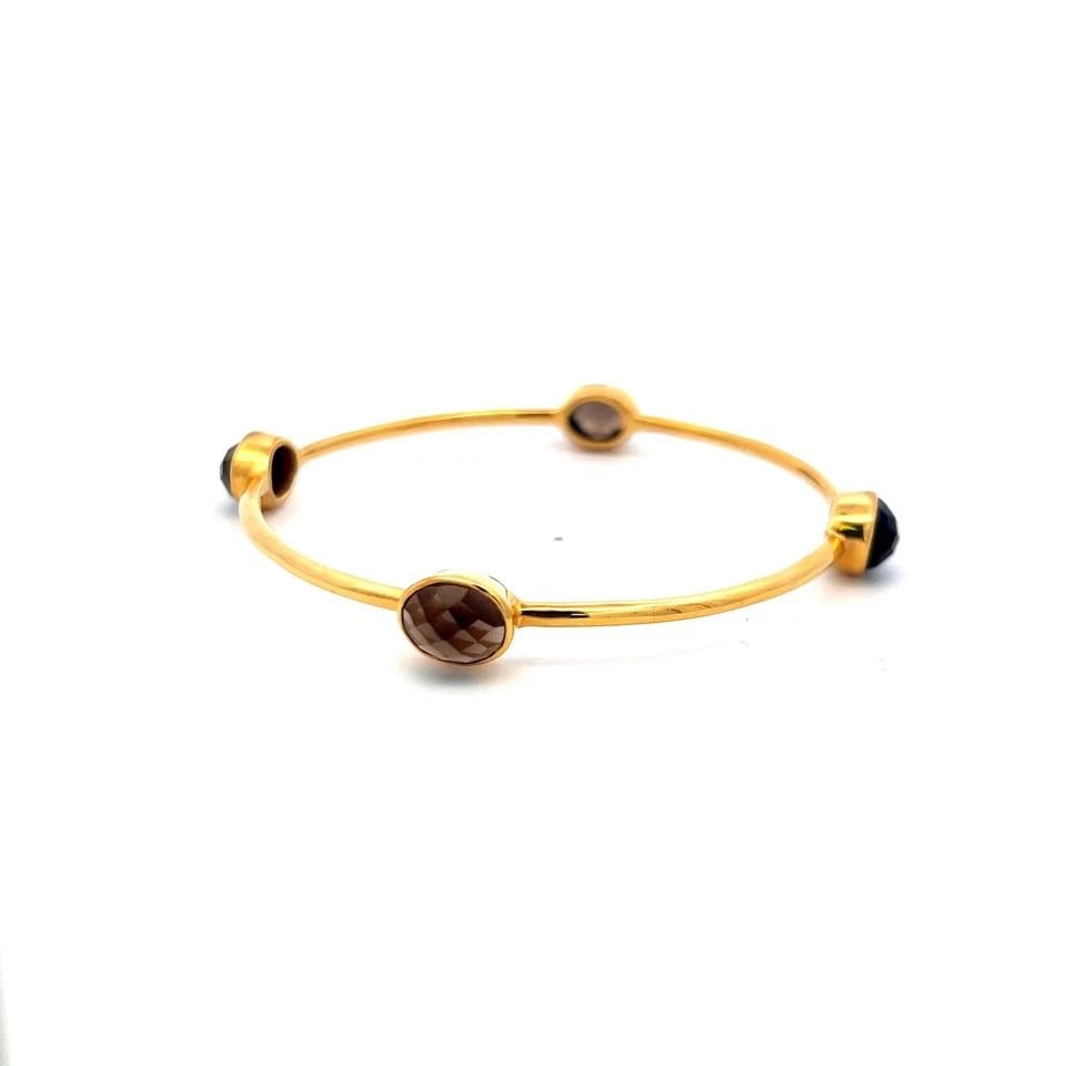 VINTAGE 12.00CT SMOKY QUARTZ BANGLE BRACELET IN 18K YELLOW GOLD – 12.5 GRAMS: VINTAGE 12.00CT SMOKY QUARTZ BANGLE BRACELET IN 18K YELLOW GOLD – 12.5 GRAMS Title: 12.00 Carat 18 Karat Yellow Gold Bangle Bracelet Style: Bangle Metal: 18 Karat Yellow Gold Gemstone 1: 12 Carat QU