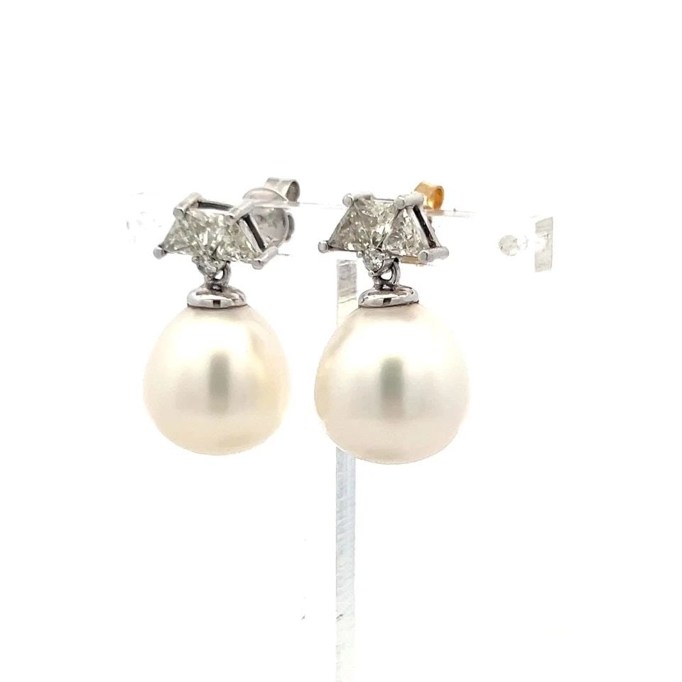 14K WHITE GOLD DROP EARRINGS WITH 1.56 CARAT DIAMONDS AND 13.2-14.6 MM PEARL: 14K WHITE GOLD DROP EARRINGS WITH 1.56 CARAT DIAMONDS AND 13.2-14.6 MM PEARL Detailed Description: Elevate your style with these vintage estate earrings, crafted in 14-karat white gold. Featuring 1.5-