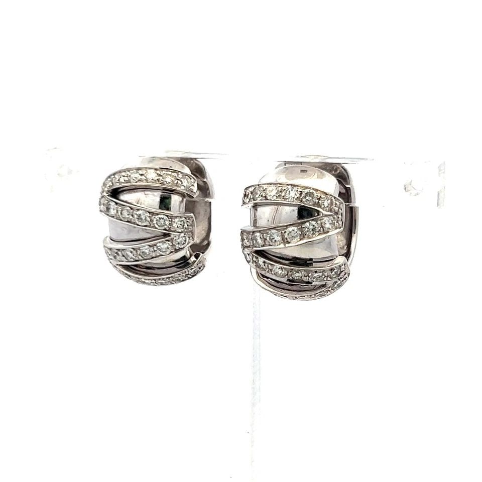 VINTAGE HUGGIE EARRINGS 18K WHITE GOLD WITH 0.72 CARAT I-SI ROUND DIAMONDS: VINTAGE HUGGIE EARRINGS 18K WHITE GOLD WITH 0.72 CARAT I-SI ROUND DIAMONDS Detailed Description: These vintage 18-karat white gold huggie earrings radiate timeless elegance, perfect for adding a touch