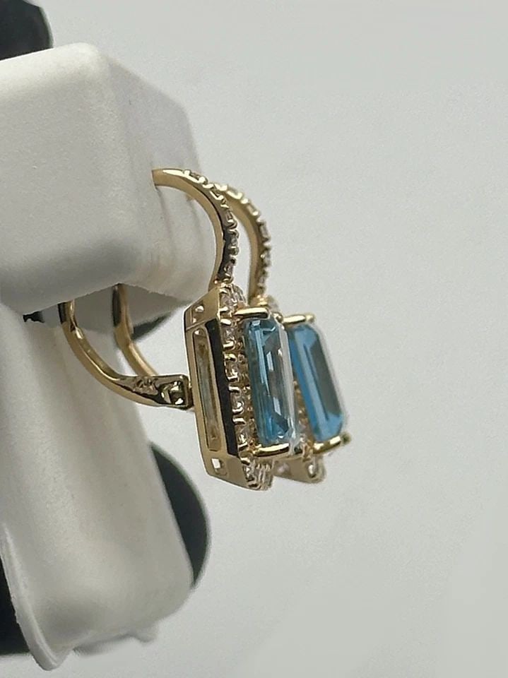 EFFY 14K GOLD EARRINGS WITH BLUE TOPAZ AND 0.75CTS OF VS CLARITY DIAMONDS 4.9G: EFFY 14k Gold Earrings with Blue Topaz and 0.75cts of VS clarity Diamonds Condition: Like New, have been fully buffed cleaned and polished by our in house Jewelers Material: 14k Yellow Gold Weight: 4.