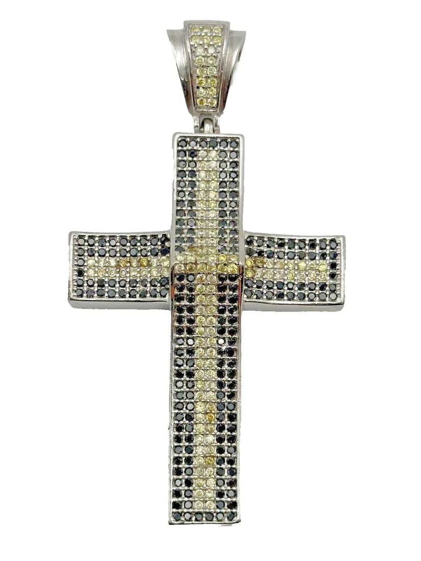 925 SILVER CROSS PENDANT WITH BLACK/YELLOW CUBIC ZIRCONIA 34.4 GRAMS: 925 Silver Cross Pendant with Black/Yellow Cubic Zirconia Condition: Used Material: 925 Sterling Silver Pendant Size: 3.25 inches x 2.75 inches Total Weight: 34.4 grams Stone Info: all Black and Yello