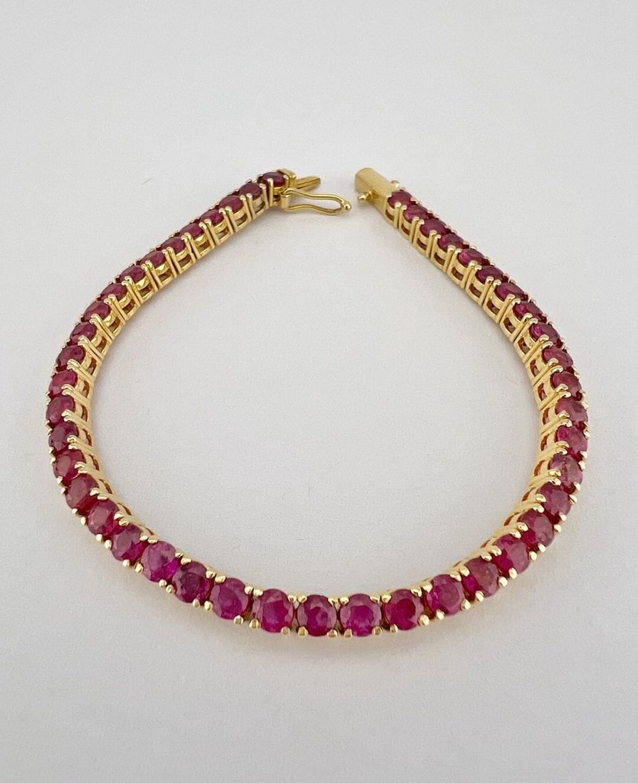 DESIGNER 12K YELLOW GOLD 6.75CT ROUND CUT RUBY INFINITY TENNIS BRACELET 6.25": DESIGNER 12K YELLOW GOLD 6.75CT ROUND CUT RUBY INFINITY TENNIS BRACELET 6.25" Designer 12k Yellow Gold 6.75ct Round Cut Ruby Infinity Tennis Bracelet 6.25" Size: 6.25" Long By (3mm) Wide Metal: Hallma