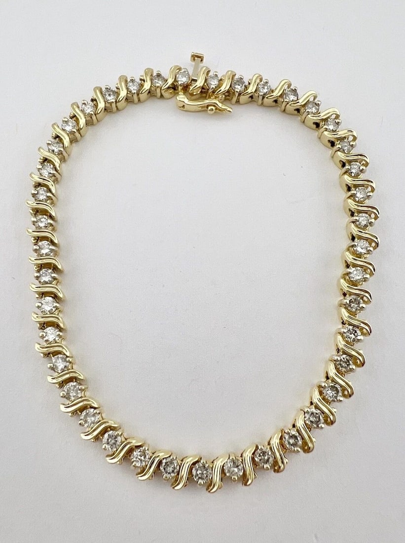 14K YELLOW GOLD 2.50CT APPROX NATURAL DIAMOND PRONG SET S LINK TENNIS BRACELET: 14K YELLOW GOLD 2.50CT APPROX NATURAL DIAMOND PRONG SET S LINK TENNIS BRACELET 14k Yellow Gold 2.50ct Approx Natural Diamond Prong Set S Link Tennis Bracelet Size: 7.55" Long By 5mm Wide Metal: 14k Ye