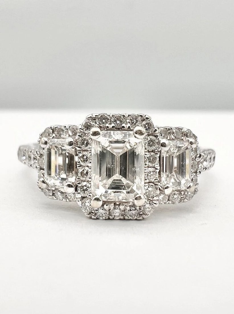 FINE PLATINUM 1.75TCW APPROX EMERALD CUT DIAMOND ENGAGEMENT WEDDING HALO RING: FINE PLATINUM 1.75TCW APPROX EMERALD CUT DIAMOND ENGAGEMENT WEDDING HALO RING Designer Platinum 1.75tcw Emerald Cut Diamond Engagement Wedding Halo Ring Size: 9.75 - Can Be Resized Metal: Platinum - T