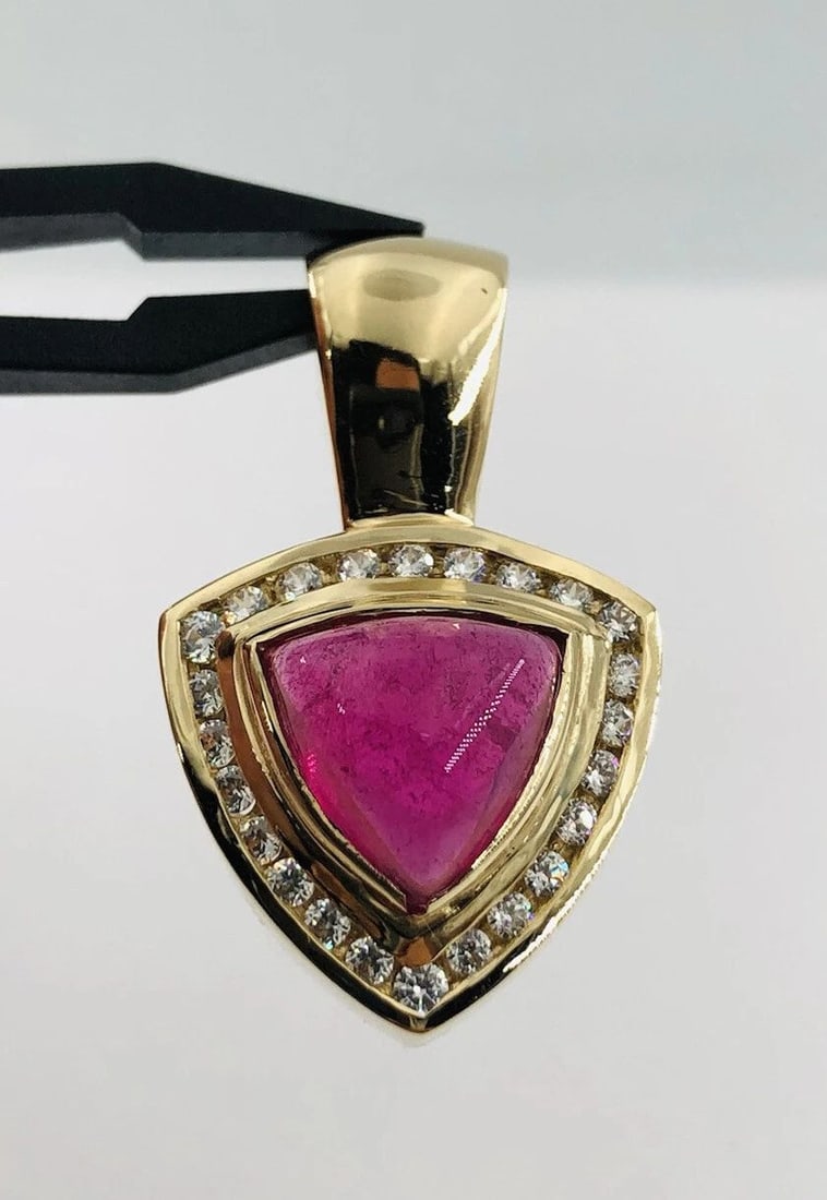 14K YELLOW GOLD CABOCHON NATURAL RUBELLITE TOURMALINE & WHITE SAPPHIRE PENDANT: 14K YELLOW GOLD CABOCHON NATURAL RUBELLITE TOURMALINE & WHITE SAPPHIRE PENDANT 14k Yellow Gold Cabochon Natural Rubellite Tourmaline & White Sapphire Pendant Size: Over 1 1/4" Tall By 3/4" Wide Weight