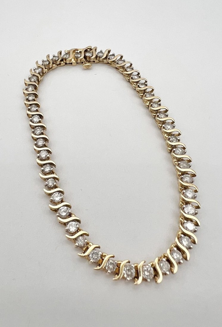 14K YELLOW GOLD 2.20CT APPROX NATURAL DIAMOND PRONG SET S LINK TENNIS BRACELET: 14K YELLOW GOLD 2.20CT APPROX NATURAL DIAMOND PRONG SET S LINK TENNIS BRACELET Designer 14k Yellow Gold 2.20ct Natural Diamond Prong Set S Link Tennis Bracelet Size: 7.25" Long By 4.5mm Wide Metal: 14