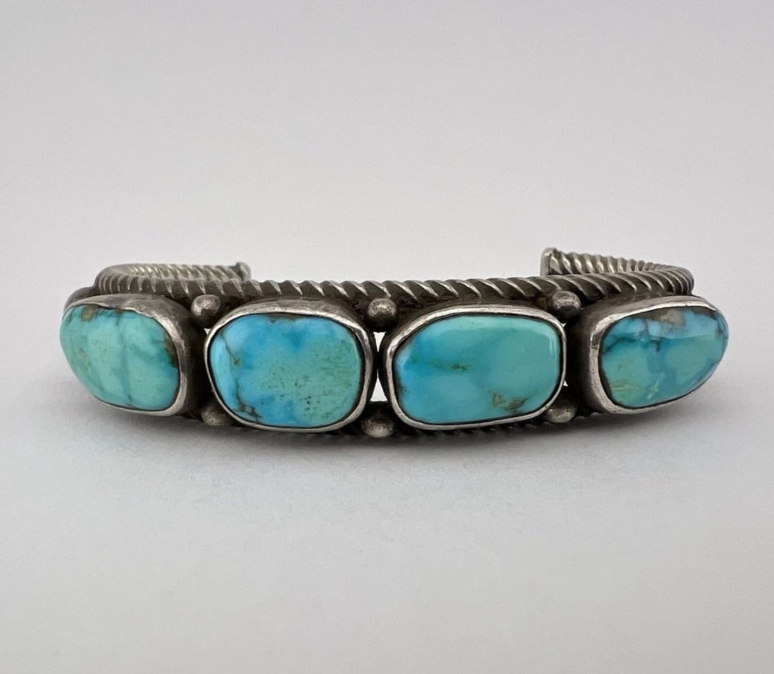 EARLY 1940'S NAVAJO COIN SILVER INGOT WEBBED FOX TURQUOISE TWIST CUFF BRACELET: EARLY 1940'S NAVAJO COIN SILVER INGOT WEBBED FOX TURQUOISE TWIST CUFF BRACELET Early 1940's Navajo Coin Silver Ingot Webbed Fox Turquoise Twist Cuff Bracelet Cuff is 4 3/4" tip to Tip and has a 1 1/2"