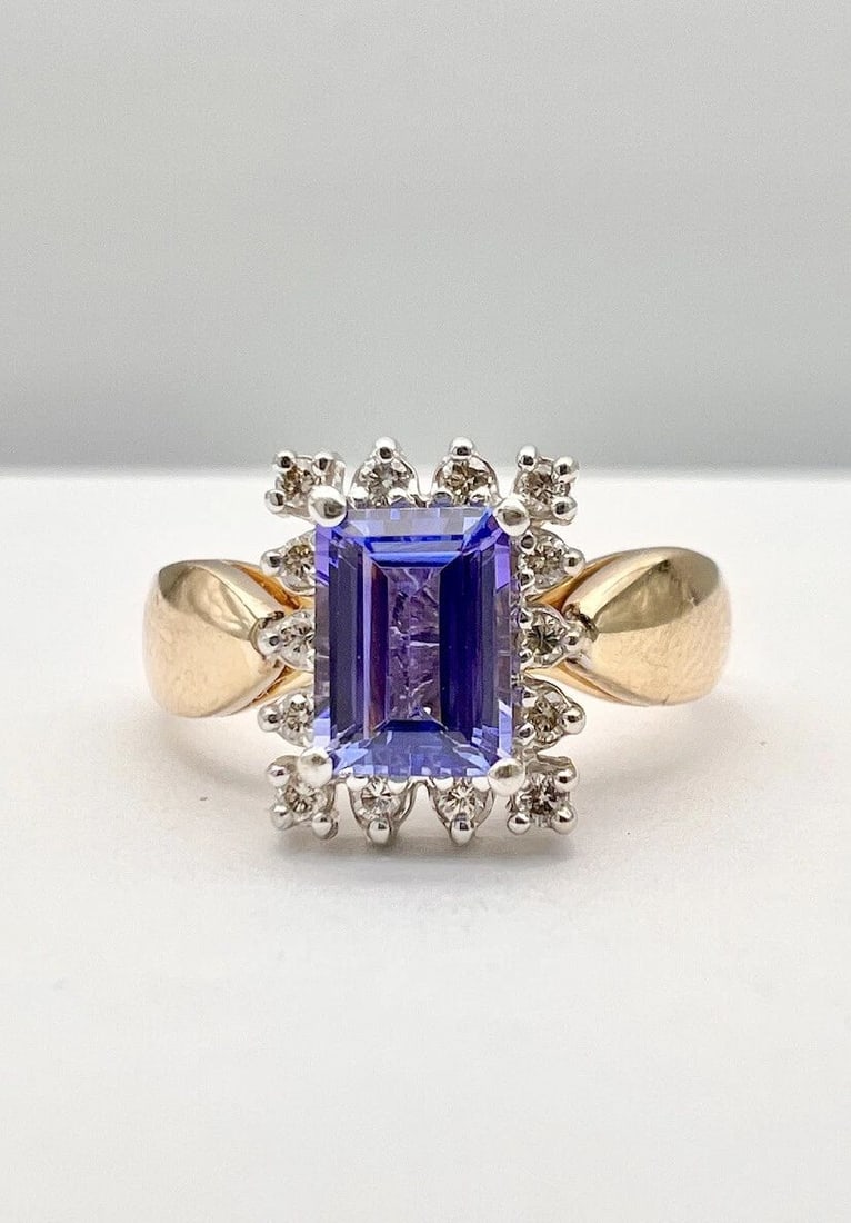 DESIGNER 14K YELLOW GOLD EMERALD CUT 1.10CT TANZANITE & DIAMOND HALO RING: DESIGNER 14K YELLOW GOLD EMERALD CUT 1.10CT TANZANITE & DIAMOND HALO RING Designer 14k Yellow Gold Emerald Cut 1.10ct Tanzanite & Diamond Halo Ring Size: 7.75 - Can Be Resized Weight is 5.3 Grams on m