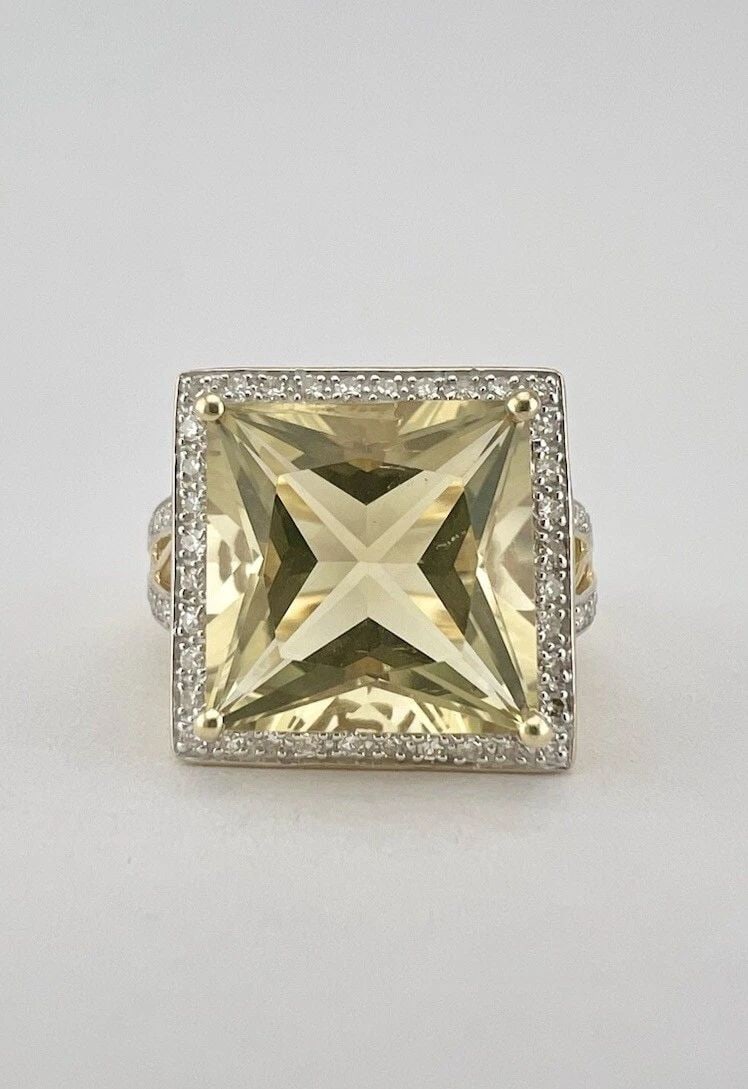 DESIGNER 14K YELLOW GOLD FANCY CUT LIGHT GREEN AMETHYST & DIAMOND RING: DESIGNER 14K YELLOW GOLD FANCY CUT LIGHT GREEN AMETHYST & DIAMOND RING Designer 14K Yellow Gold Fancy Cut Light Green Amethyst & Diamond Ring Size: 7 - Can Be Sized Without Damaging Weight is 5.9 Gram