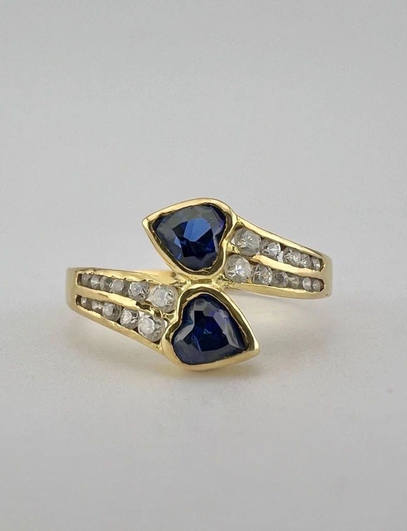 DESIGNER 18K YELLOW GOLD HEART SHAPED BLUE SAPPHIRE & DIAMOND BYPASS RING: DESIGNER 18K YELLOW GOLD HEART SHAPED BLUE SAPPHIRE & DIAMOND BYPASS RING Designer 18K Yellow Gold Heart Shaped Blue Sapphire & Diamond Bypass Ring Ring Size: 6.75 - Can be Resized With Out Damage Wei