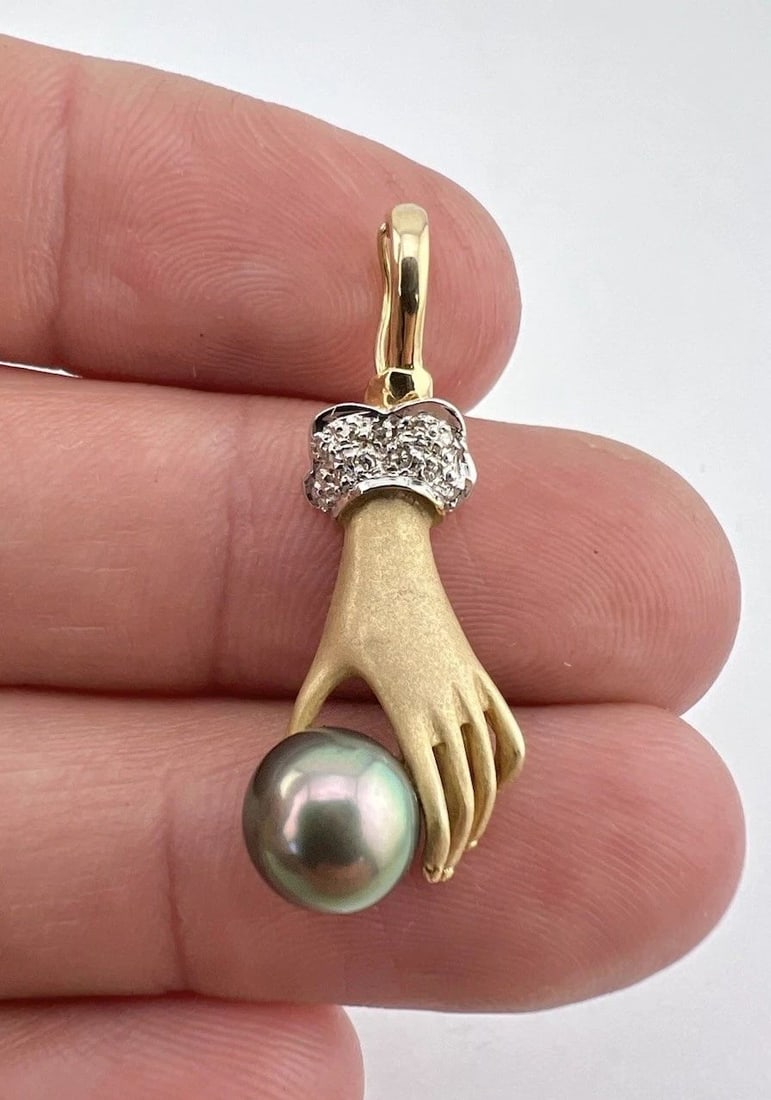 VINTAGE 14K YELLOW GOLD DIAMOND & HAND HOLDING TAHITIAN PEARL ENHANCER PENDANT: VINTAGE 14K YELLOW GOLD DIAMOND & HAND HOLDING TAHITIAN PEARL ENHANCER PENDANT Vintage 14k Yellow Gold Diamond & Hand Holding Tahitian Pearl Enhancer Pendant Pendant Size: Over 1 1/4" Tall With Bail b