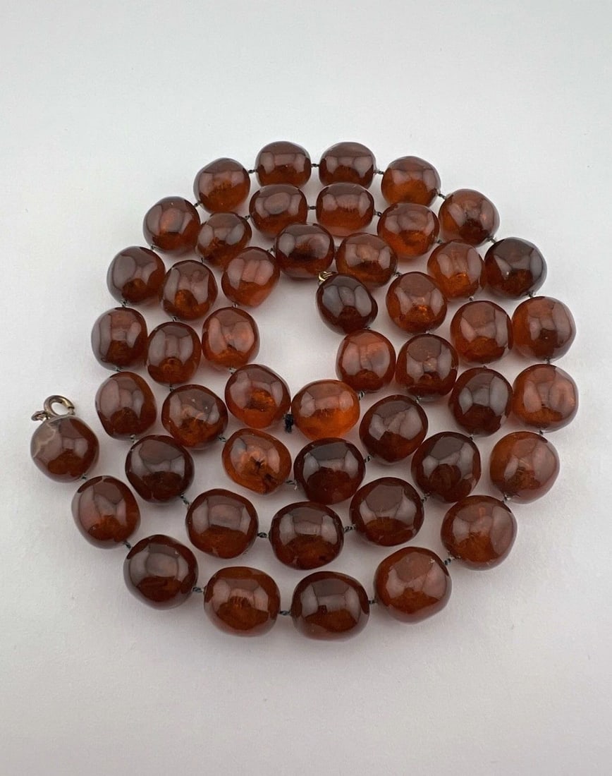 ANTIQUE CHINESE GENUINE BALTIC HONEY AMBER STONE NECKLACE - 60.5 GRAMS - 31.5": ANTIQUE CHINESE GENUINE BALTIC HONEY AMBER STONE NECKLACE - 60.5 GRAMS - 31.5" Antique Chinese Genuine Baltic Honey Amber Stone Necklace - 60.5 Grams Necklace Size: 31.5" Long tip To Tip Total Weight 