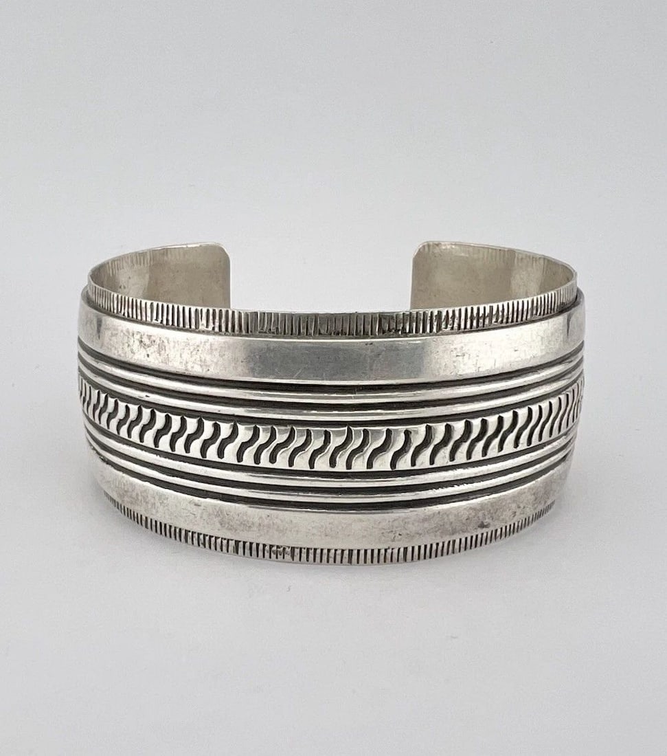 HUGE VTG MIKE BEGAY NAVAJO STERLING SILVER DEEP STAMPED WIDE CUFF BRACELET 54G: HUGE VTG MIKE BEGAY NAVAJO STERLING SILVER DEEP STAMPED WIDE CUFF BRACELET 54G HUGE Vtg Mike Begay Navajo Sterling Silver Deep Stamped Wide Cuff Bracelet 54g Cuff is 5 3/4" Tip to Tip and has a 1 1/8"