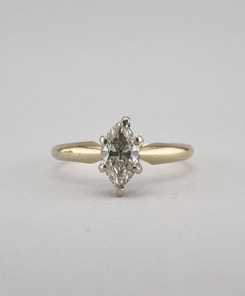VINTAGE 14K YELLOW GOLD .35CT GENUINE MARQUISE DIAMOND ENGAGEMENT RING: VINTAGE 14K YELLOW GOLD .35CT GENUINE MARQUISE DIAMOND ENGAGEMENT RING Vintage 14k Yellow Gold .35ct Genuine Marquise Diamond Engagement Ring Ring Size: 7.25 - Can Be Sized Without Damaging Weight is 