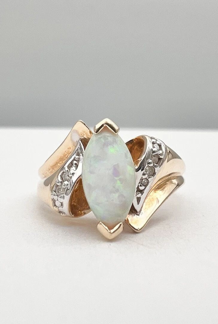DESIGNER 10K YELLOW GOLD CABOCHON AUSTRALIAN BOULDER FIRE OPAL & DIAMOND RING: DESIGNER 10K YELLOW GOLD CABOCHON AUSTRALIAN BOULDER FIRE OPAL & DIAMOND RING Designer 10k Yellow Gold Cabochon Australian Boulder Fire Opal & Diamond Ring Size: 5.25 - Can Be Resized Weight is 3.2 Gr