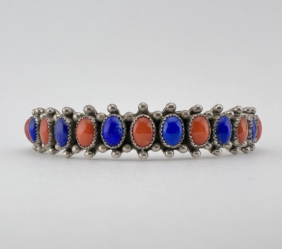 VINTAGE NAVAJO STERLING SILVER LAPIS LAZULI & RED CORAL 1 ROW CUFF BRACELET: VINTAGE NAVAJO STERLING SILVER LAPIS LAZULI & RED CORAL 1 ROW CUFF BRACELET Vintage Navajo Sterling Silver Lapis Lazuli & Red Coral 1 Row Cuff Bracelet Cuff is Around 5 1/2" tip to Tip and has a 1" Wi