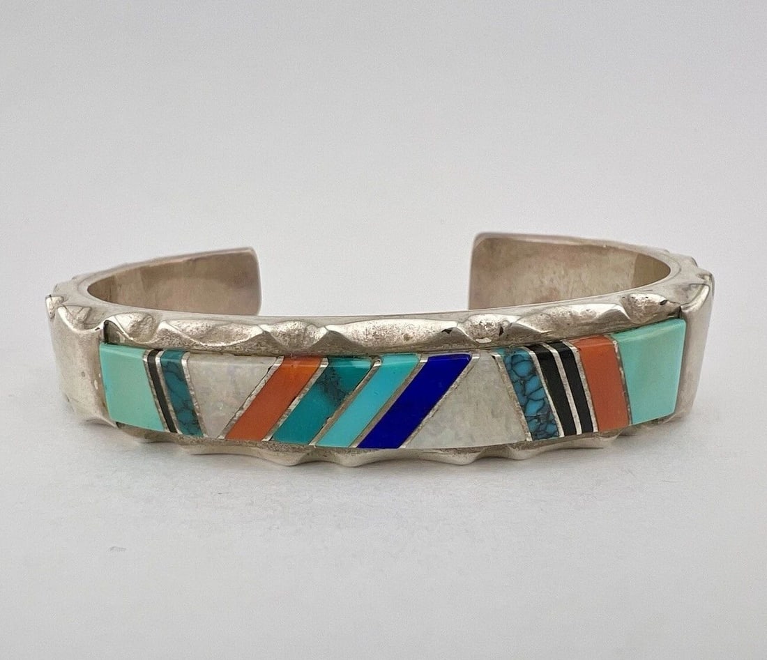 VTG RICK TOLINO NAVAJO STERLING SILVER MULTI GEMSTONE FLUSH INLAY CUFF BRACELET: VTG RICK TOLINO NAVAJO STERLING SILVER MULTI GEMSTONE FLUSH INLAY CUFF BRACELET Vtg Rick Tolino Navajo Sterling Silver Multi Gemstone Flush Inlay Cuff Bracelet Cuff is 5 1/8" tip to Tip and has a 1 1/