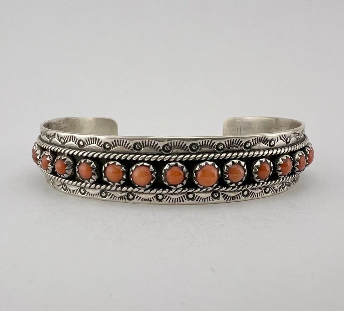 VTG NAVAJO STERLING SILVER MEDITERRANEAN RED CORAL STAMPED 1 ROW CUFF BRACELET: VTG NAVAJO STERLING SILVER MEDITERRANEAN RED CORAL STAMPED 1 ROW CUFF BRACELET Vtg Navajo Sterling Silver Mediterranean Red Coral Stamped 1 Row Cuff Bracelet Cuff is Over 5 1/4" tip to Tip and has a 1
