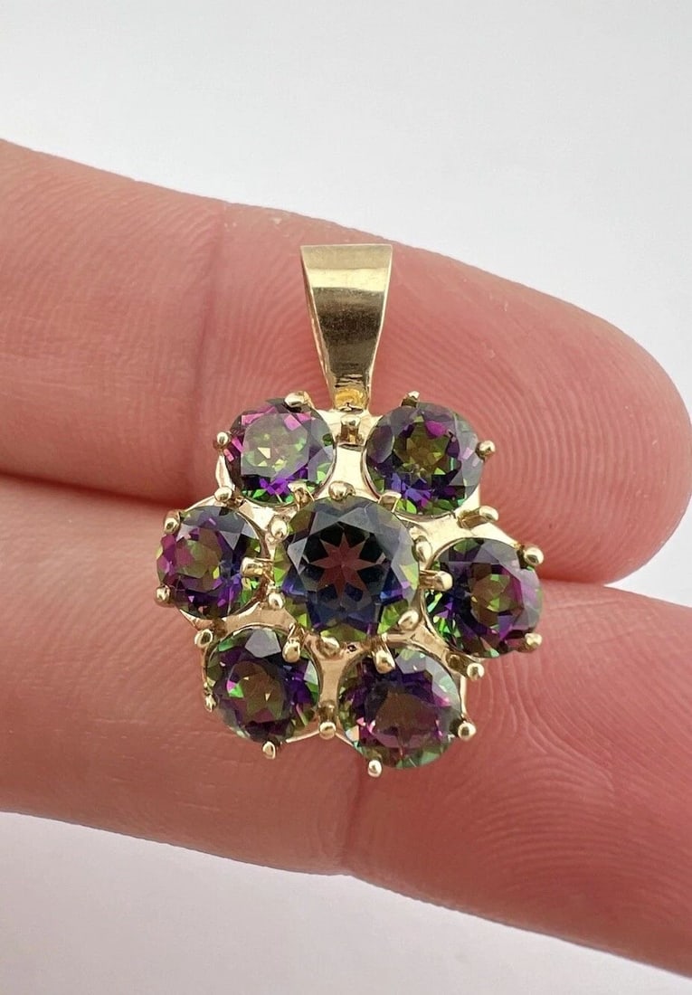 DESIGNER 10K YELLOW GOLD MYSTIC TOPAZ CLUSTER FLOWER PENDANT: DESIGNER 10K YELLOW GOLD MYSTIC TOPAZ CLUSTER FLOWER PENDANT Designer 10k Yellow Gold Mystic Topaz Cluster Flower Pendant Size: About 1" Tall With bail by 5/8" Wide Weight is 3.3 Grams on my scale Met