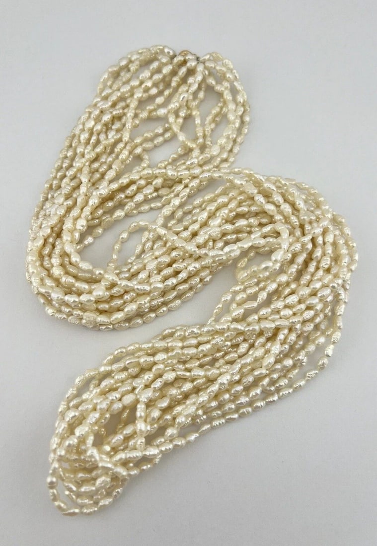 VINTAGE 14K GOLD FRESHWATER RICE PEARL OPERA 10 STAND NECKLACE 33": VINTAGE 14K GOLD FRESHWATER RICE PEARL OPERA 10 STAND NECKLACE 33" Vintage 14k Gold Freshwater Rice Pearl Opera 10 Stand Necklace 33" No Claps - 33" Long Weight is 141.5 Grams on my scale Amaizing Fre