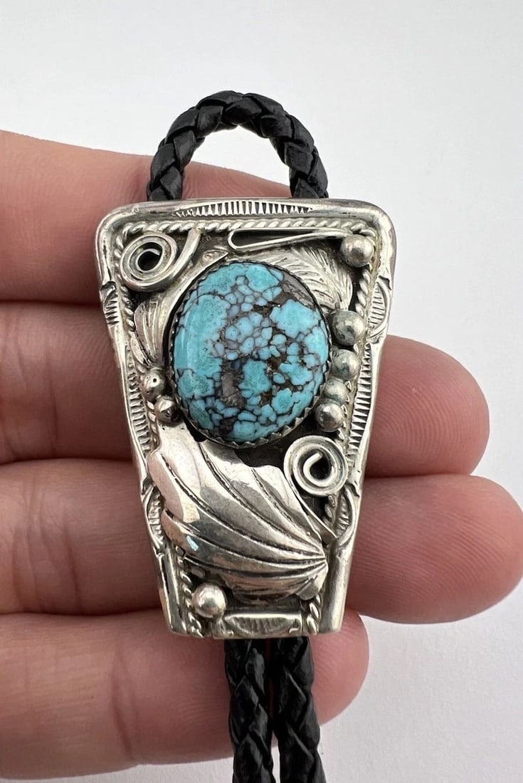 VTG JUSTIN MORRIS NAVAJO STERLING SILVER SPIDERWEB TURQUOISE STAMPED BOLO TIE: VTG JUSTIN MORRIS NAVAJO STERLING SILVER SPIDERWEB TURQUOISE STAMPED BOLO TIE Vtg Justin Morris Navajo Sterling Silver Spiderweb Turquoise Stamped Bolo Tie Size: Just Under 1 3/4" Tall by 1 1/4" Wide 