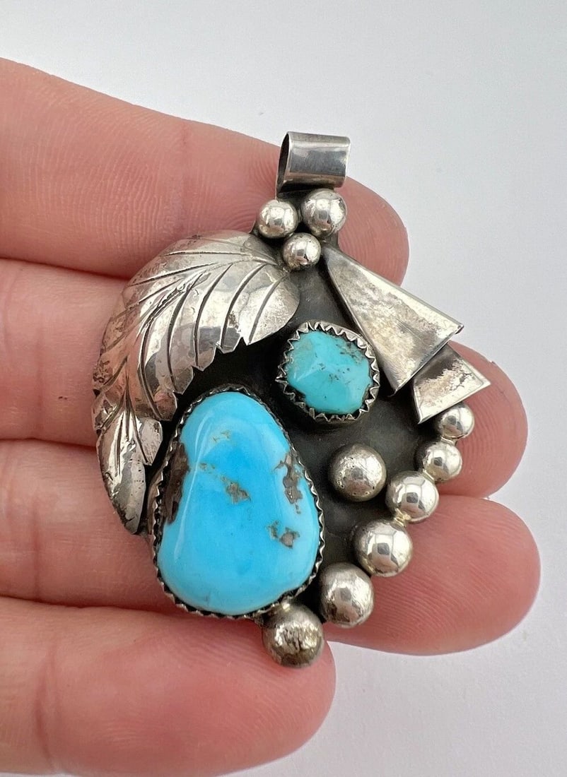 VINTAGE ZUNI STERLING SILVER BLUE KINGMAN TURQUOISE STAMPED PENDANT 2": VINTAGE ZUNI STERLING SILVER BLUE KINGMAN TURQUOISE STAMPED PENDANT 2" Vintage ZUNI Sterling Silver Blue Kingman Turquoise Stamped Pendant 2" Size: About 2" Tall With bail by 1 3/8" Wide Weight is 13.