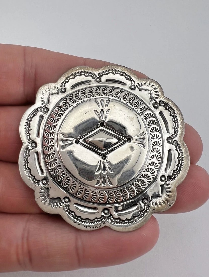 SUZIE JAMES NAVAJO STERLING SILVER DEEP STAMPED ROUND CONCHO PIN BROOCH 2 1/8": SUZIE JAMES NAVAJO STERLING SILVER DEEP STAMPED ROUND CONCHO PIN BROOCH 2 1/8" Suzie James Navajo Sterling Silver Deep Stamped Round Concho Pin Brooch 2 1/8" Size: 2 1/8" Tall & Wide Metal: Sterling S