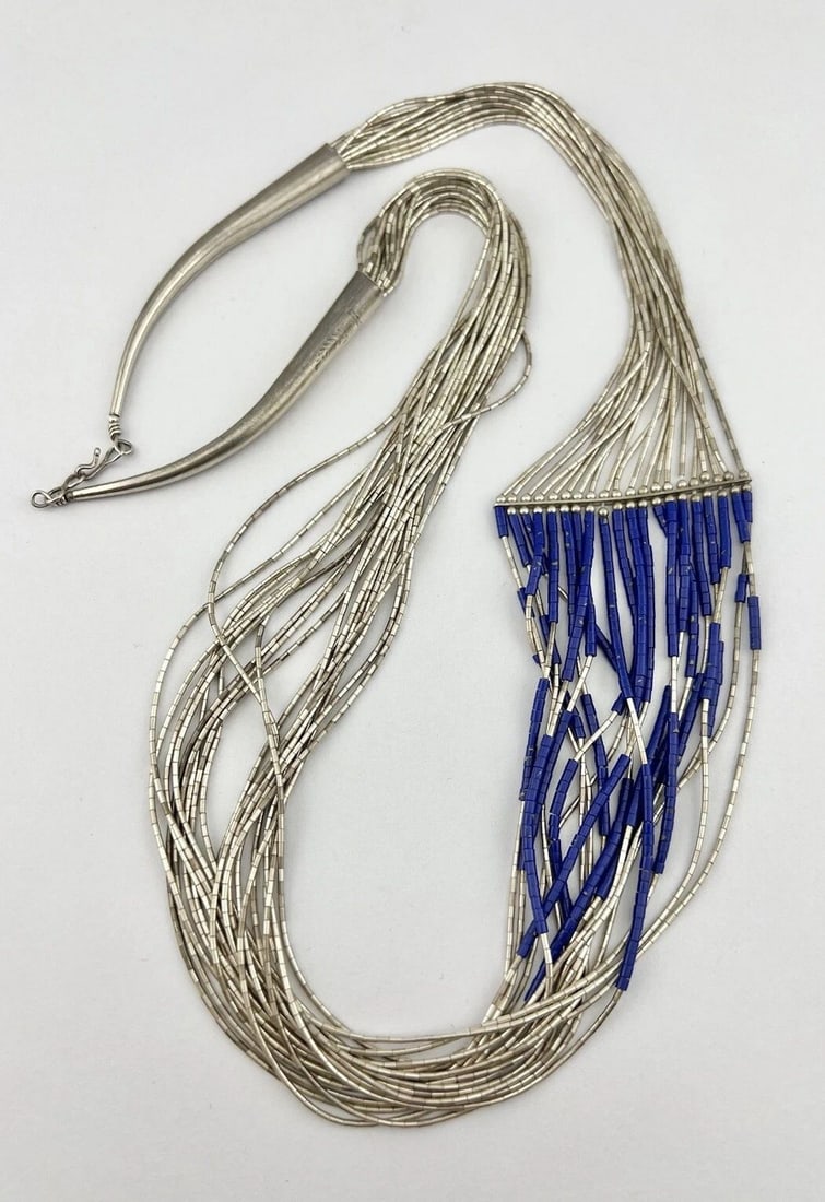 VINTAGE NAVAJO 20 STRAND LIQUID STERLING SILVER & LAPIS LAZULI NECKLACE 66.3G: VINTAGE NAVAJO 20 STRAND LIQUID STERLING SILVER & LAPIS LAZULI NECKLACE 66.3G Vintage Native American 20 Strand Liquid Sterling Silver & Lapis Lazuli Necklace Size: 28" Long - 20 Strands Total Weight 