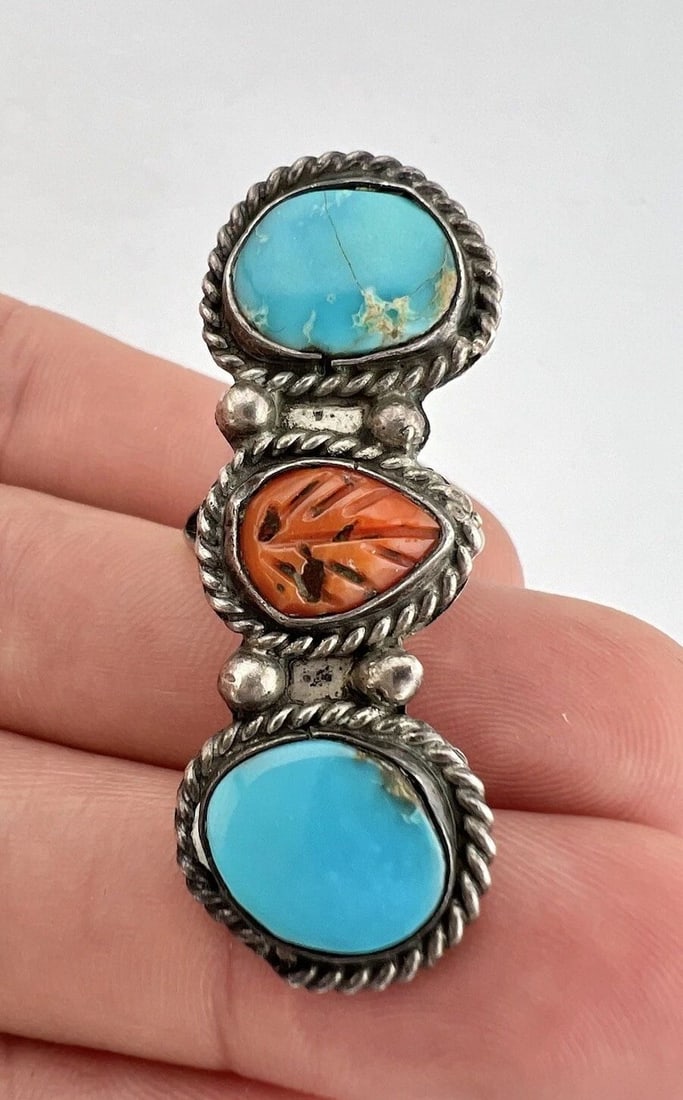VTG NAVAJO STERLING SILVER TURQUOISE & CARVED CORAL STAMPED LONG RING 1 7/8": VTG NAVAJO STERLING SILVER TURQUOISE & CARVED CORAL STAMPED LONG RING 1 7/8" Vtg Navajo Sterling Silver Turquoise & Carved Coral Stamped Long Ring 1 7/8" Size: 6.5- Can Be Re Sized Weight is 8.8 Grams