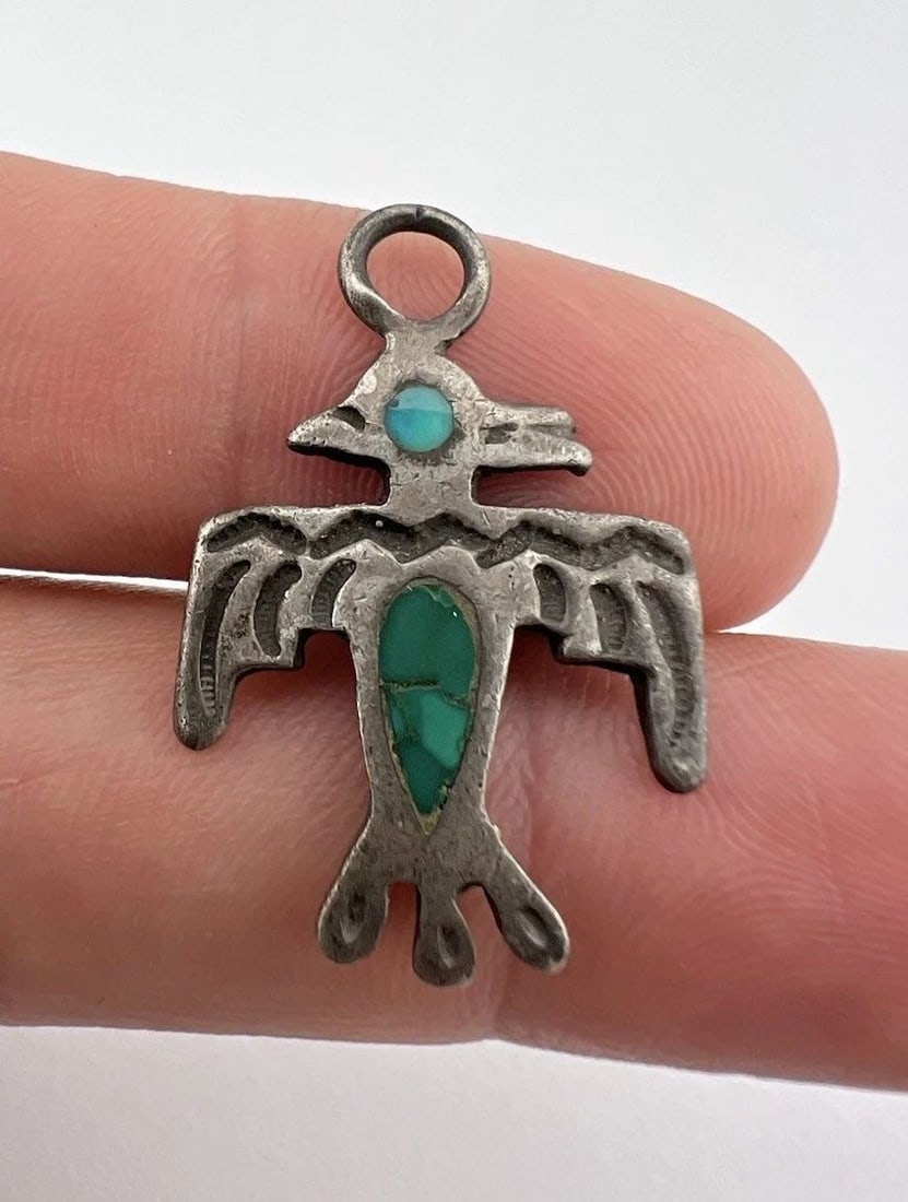 EARLY 1940'S NAVAJO STERLING SILVER FLUSH TURQUOISE THUNDERBIRD BIRD PENDANT: EARLY 1940'S NAVAJO STERLING SILVER FLUSH TURQUOISE THUNDERBIRD BIRD PENDANT Early 1940's Navajo Sterling Silver Flush Turquoise Thunderbird Bird Pendant Size: Almost 1 1/4" Tall By Over 3/4" Wide Met