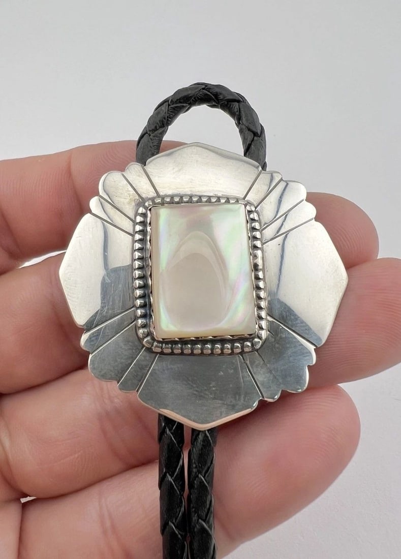 VINTAGE NAVAJO STERLING SILVER MOTHER OF PEARL STAMPED RECTANGLE BOLO TIE 1 5/8": VINTAGE NAVAJO STERLING SILVER MOTHER OF PEARL STAMPED RECTANGLE BOLO TIE 1 5/8" Vintage Navajo Sterling Silver Mother Of Pearl Stamped Rectangle Bolo Tie 1 5/8" Size: 1 5/8" Tall & Wide Weight is 20.