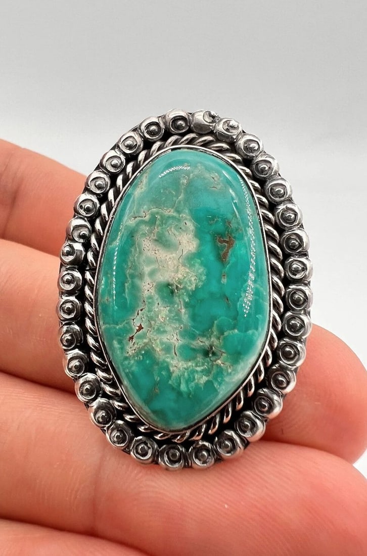 VINTAGE 1.5" NAVAJO STERLING SILVER CARICO LAKE TURQUOISE STAMPED RING 14G: VINTAGE 1.5" NAVAJO STERLING SILVER CARICO LAKE TURQUOISE STAMPED RING 14G Vintage 1.5" Navajo Sterling Silver Carico Lake Turquoise Stamped Ring 14g Size: 7.5 - Can Be Resized Weight is 14.0 Grams on