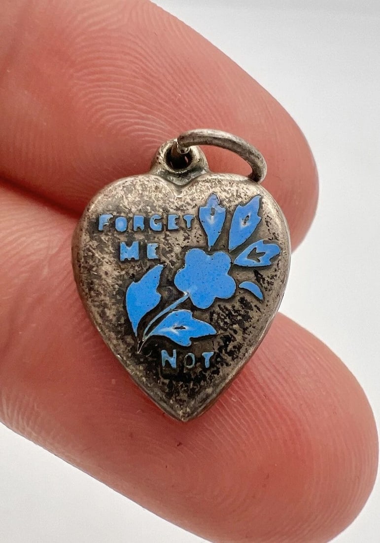 ANTIQUE STERLING SILVER BLUE ENAMEL FORGET ME FLOWER PUFFY HEART CHARM: ANTIQUE STERLING SILVER BLUE ENAMEL FORGET ME FLOWER PUFFY HEART CHARM Antique Sterling Silver Blue Enamel Forget Me Flower Puffy Heart Charm Size: 7/8" Tall by 5/8" Wide Metal: Sterling Silver Weight