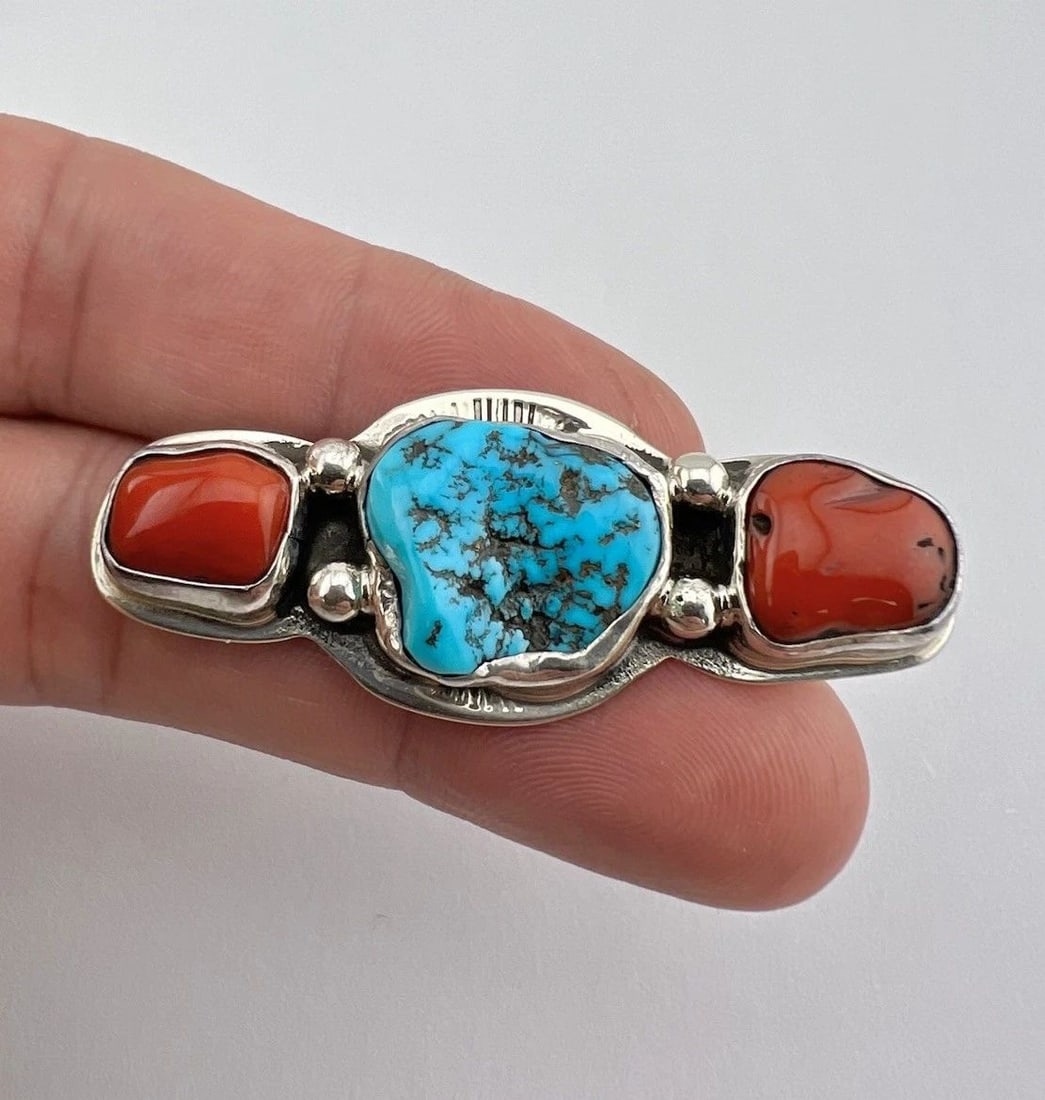VTG NAVAJO STERLING SILVER SLEEPING BEAUTY TURQUOISE & CORAL STAMPED PIN BROOCH: VTG NAVAJO STERLING SILVER SLEEPING BEAUTY TURQUOISE & CORAL STAMPED PIN BROOCH Vtg Navajo Sterling Silver Sleeping Beauty Turquoise & Coral Stamped Pin Brooch Size: 7/8" Tall & 2 1/8" Wide Metal: Ste