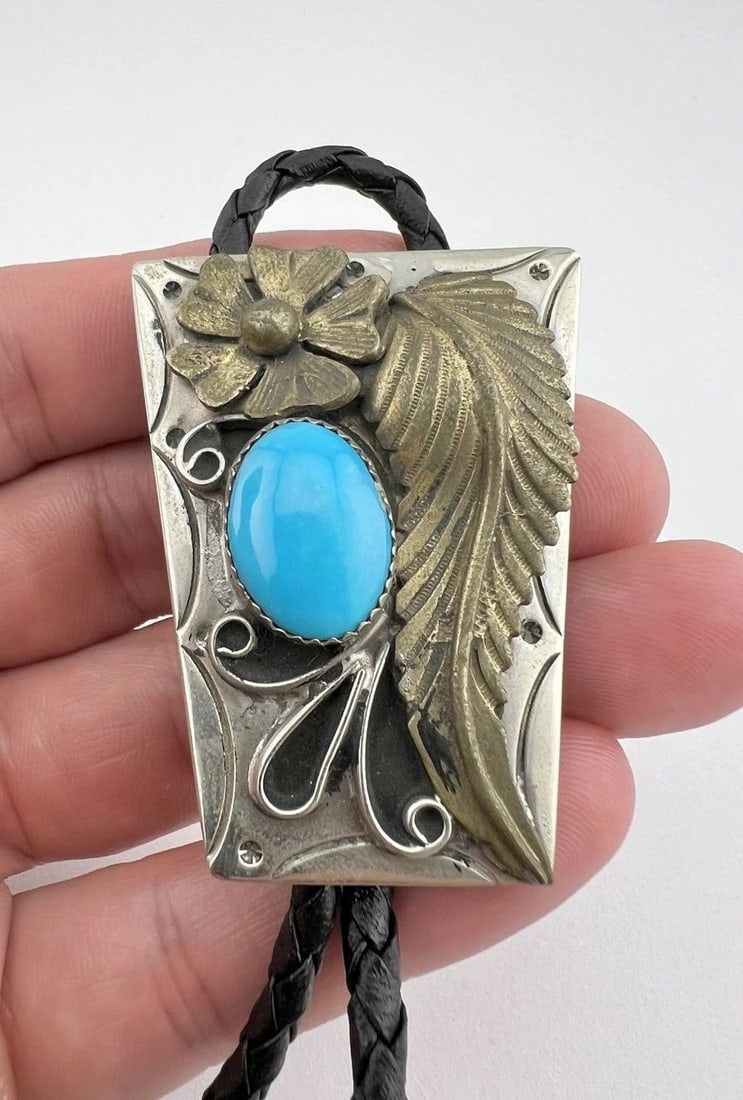 VINTAGE NAVAJO NICKEL SILVER SLEEPING BEAUTY TURQUOISE STAMPED BOLO TIE 2": VINTAGE NAVAJO NICKEL SILVER SLEEPING BEAUTY TURQUOISE STAMPED BOLO TIE 2" Vintage Navajo Nickel Silver Sleeping Beauty Turquoise Stamped Bolo Tie 2" Size: 2" Tall by 1 1/2" Wide at The Top Weight is 