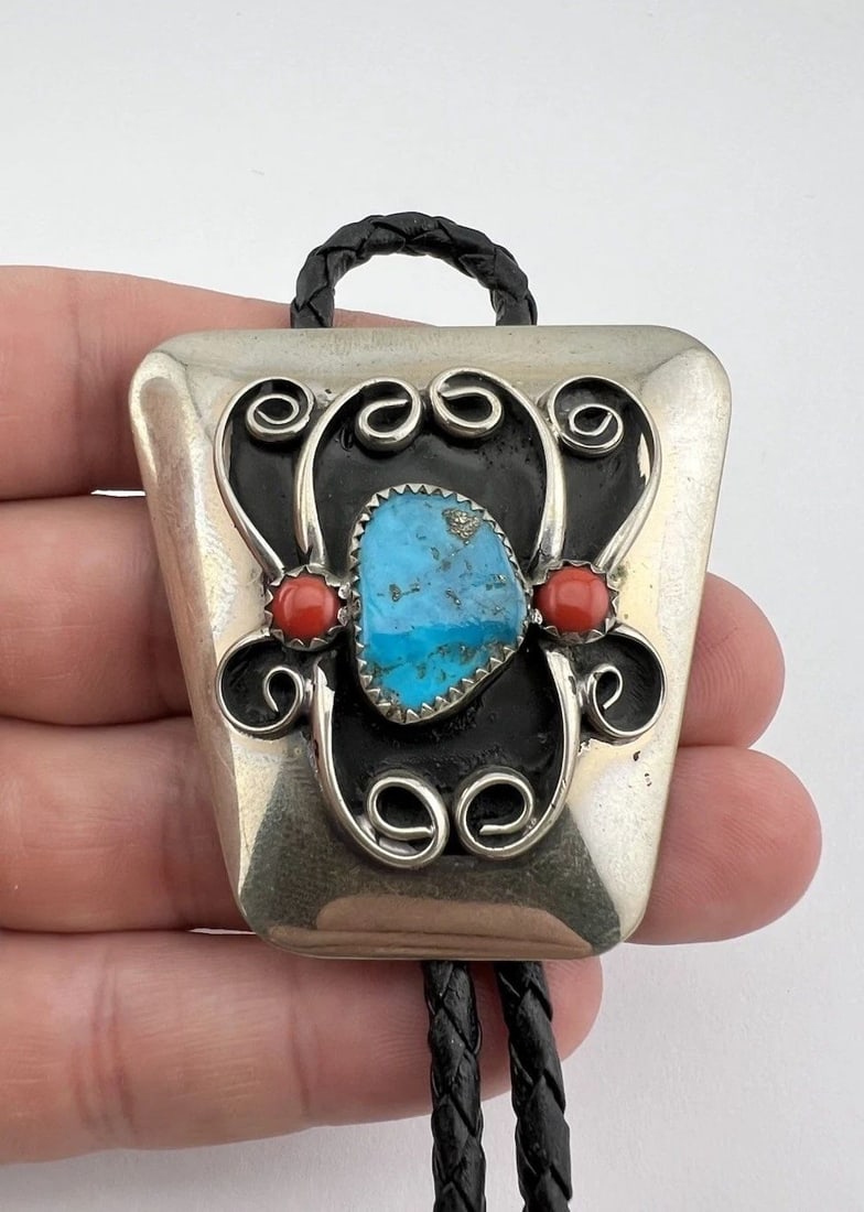 VINTAGE NAVAJO NICKEL SILVER HIGH GRADE TURQUOISE & CORAL STAMPED BOLO TIE 2": VINTAGE NAVAJO NICKEL SILVER HIGH GRADE TURQUOISE & CORAL STAMPED BOLO TIE 2" Vintage Navajo Nickel Silver High Grade Turquoise & Coral Stamped Bolo Tie 2" Size: 2" Tall by 2" Wide at The Top Weight i