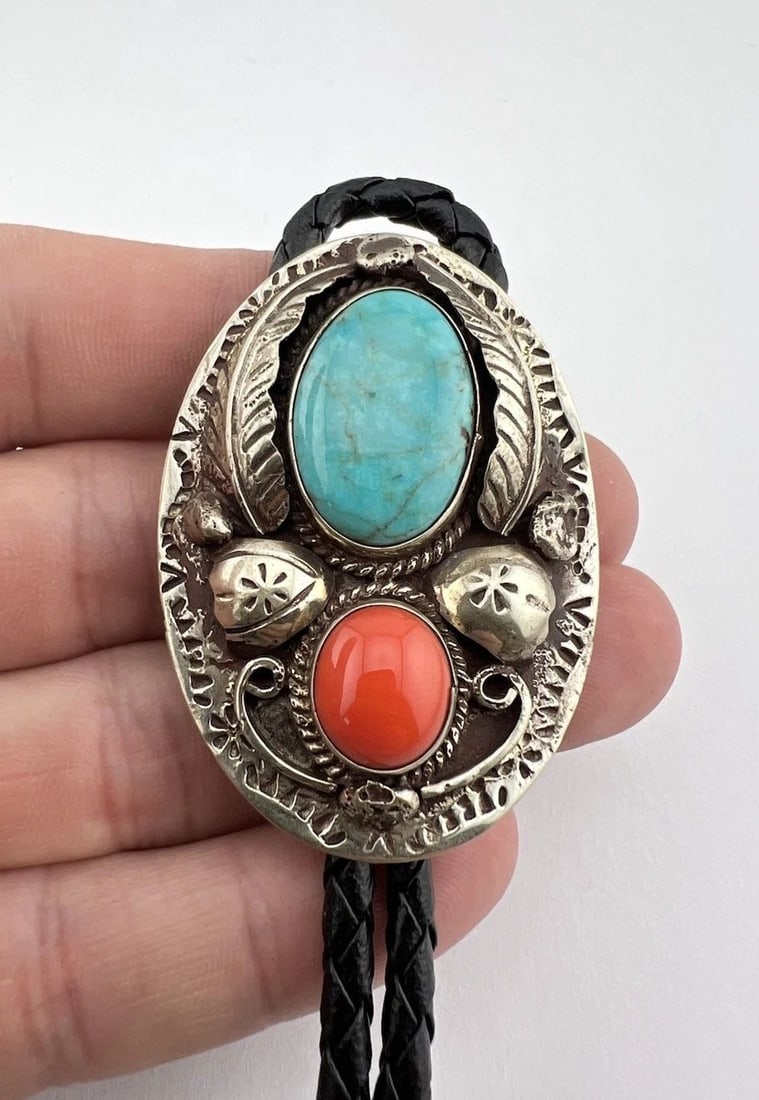 VTG NAVAJO NICKEL SILVER HIGH GRADE TURQUOISE & CORAL STAMPED OVAL BOLO TIE 2": VTG NAVAJO NICKEL SILVER HIGH GRADE TURQUOISE & CORAL STAMPED OVAL BOLO TIE 2" Vtg Navajo Nickel Silver High Grade Turquoise & Coral Stamped Oval Bolo Tie 2" Size: 2" Tall by About 1 1/2" Wide Weight 
