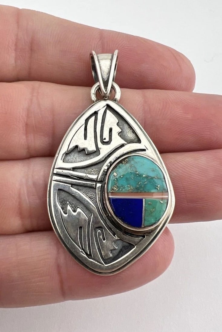 VINTAGE NAVAJO STERLING SILVER FLUSH MULT GEMSTONE OVERLAY TRIBAL DESIGN PENDANT: VINTAGE NAVAJO STERLING SILVER FLUSH MULT GEMSTONE OVERLAY TRIBAL DESIGN PENDANT Vintage Navajo Sterling Silver Flush Mult Gemstone Overlay Tribal Design Pendant Size: 2" Tall With Bail & 1 1/8" Wide 
