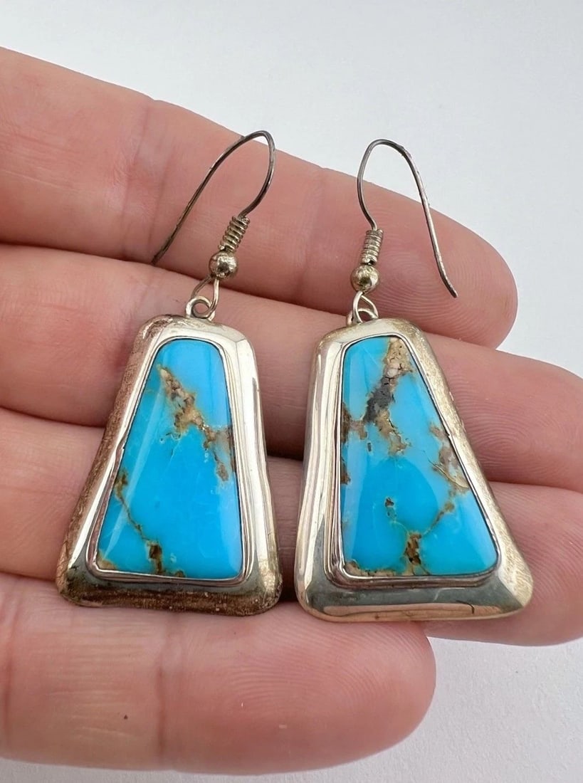 VTG NAVAJO STERLING SILVER HIGH GRADE PILOT MOUNTAIN TURQUOISE POST EARRINGS: VTG NAVAJO STERLING SILVER HIGH GRADE PILOT MOUNTAIN TURQUOISE POST EARRINGS Vtg Navajo Sterling Silver High Grade Pilot Mountain Turquoise Post Earrings Size: 1 7/8" Tall With Dangle & 7/8" Wide Weig