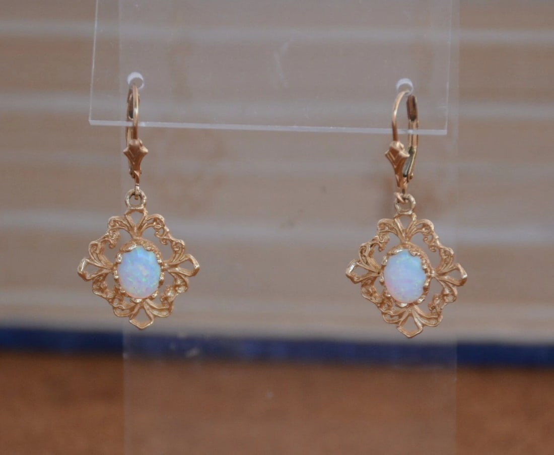 VINTAGE SOLID 14K YELLOW GOLD DANGLE EARRINGS - OPAL - 1 3/8" DROP: VINTAGE SOLID 14K YELLOW GOLD DANGLE EARRINGS - OPAL - 1 3/8" DROP Item Description: This pair of vintage earrings have opals set into beautiful 14K solid gold settings. The earring pendants measure 3