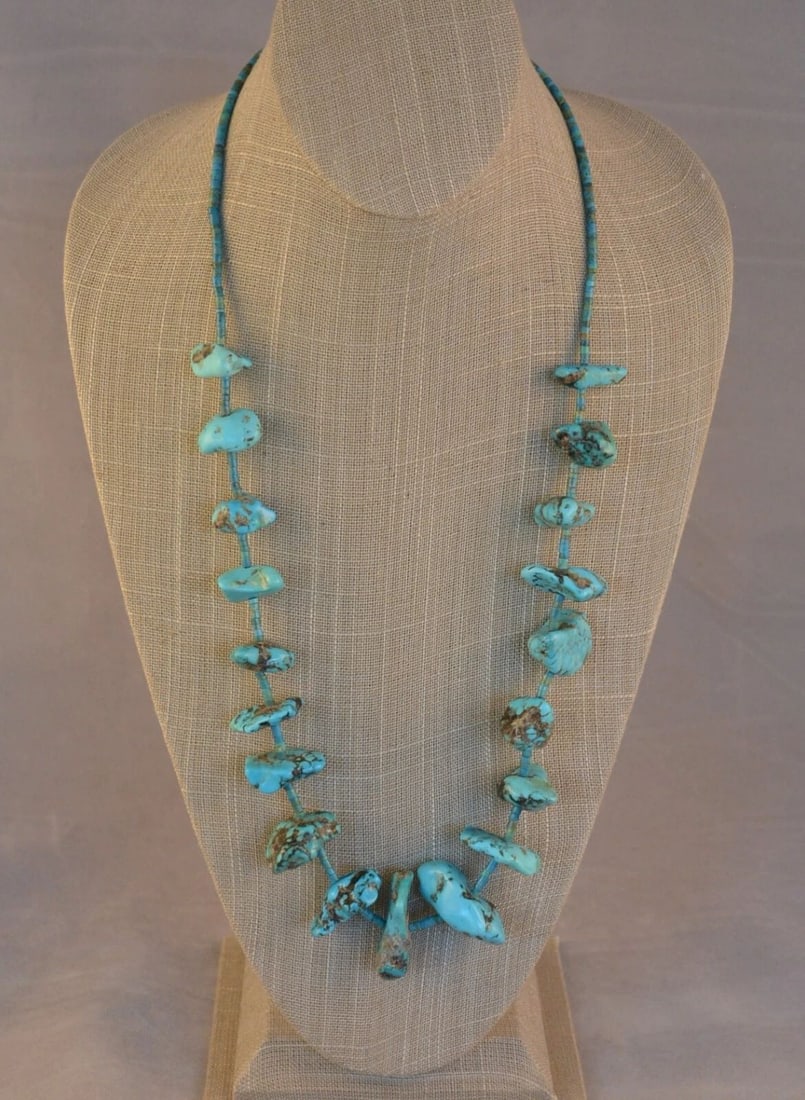 VINTAGE NAVAJO GRADUATED TURQUOISE NUGGET AND HEISHI BEAD NECKLACE - 27 3/4": VINTAGE NAVAJO GRADUATED TURQUOISE NUGGET AND HEISHI BEAD NECKLACE - 27 3/4" This vintage Navajo necklace has graduated turquoise nuggets alternating with fine turquoise heishi. The necklace is 27 3/4