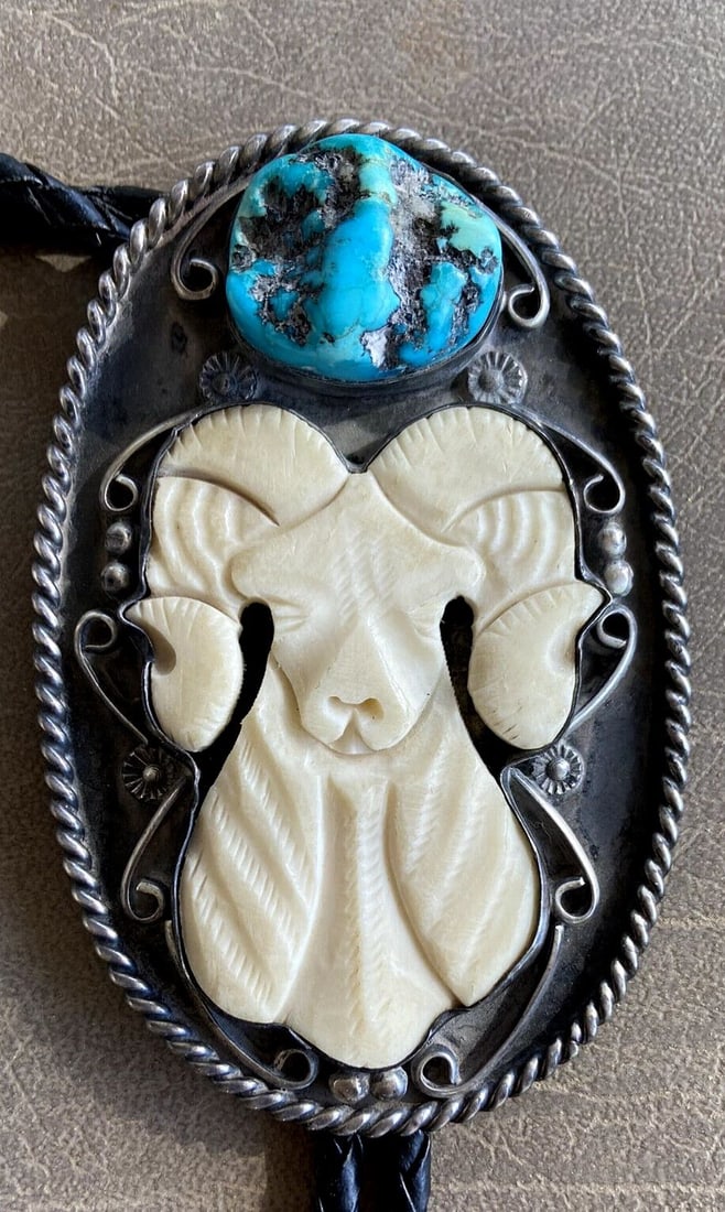 VTG NAVAJO INDIAN BOLO TIE PENDANT - HANDCARVED WHITE RAM & LG TURQUOISE NUGGET: VTG NAVAJO INDIAN BOLO TIE PENDANT - HANDCARVED WHITE RAM & LG TURQUOISE NUGGET Item Description: This large vintage Navajo bolo tie is set with a beautifully carved white ram's head and a large turqu