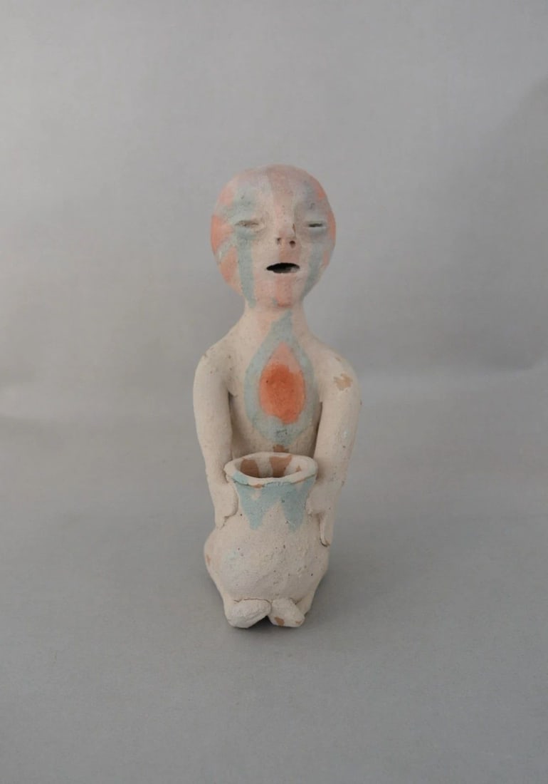 OLD TESUQUE RAIN GOD - EARTHENWARE POTTERY FIGURE -: OLD TESUQUE RAIN GOD - EARTHENWARE POTTERY FIGURE - This is an early Tesuque earthenware pottery figurine. It is 7" tall by 2 3/4" across. It is in good condition. This is a nice early piece - possibl
